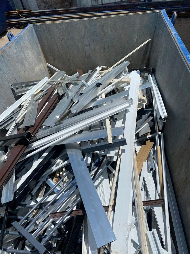 A Pile of Scrap Metal Is Sitting in A Dumpster — H & H Metal Recycling In Kunda Park, QLD