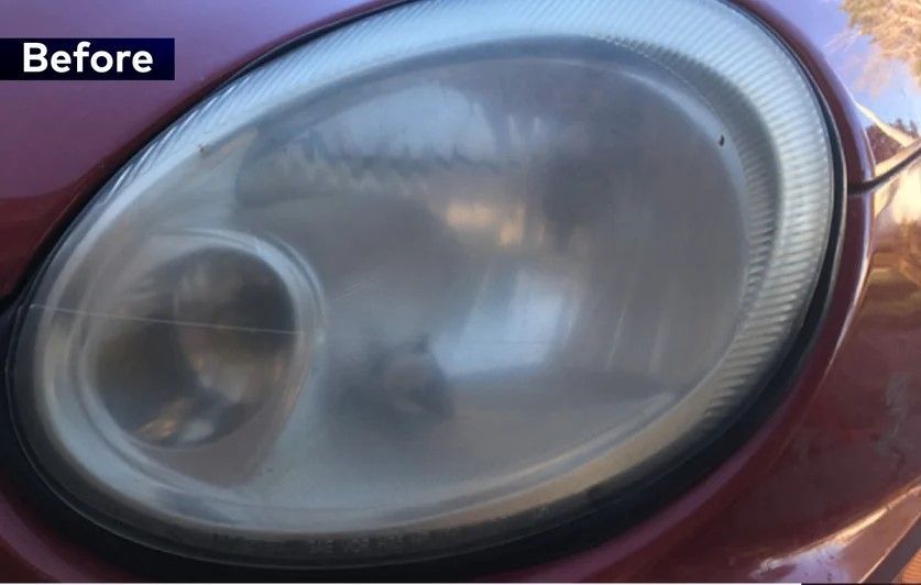 A close up of a car headlight before being cleaned