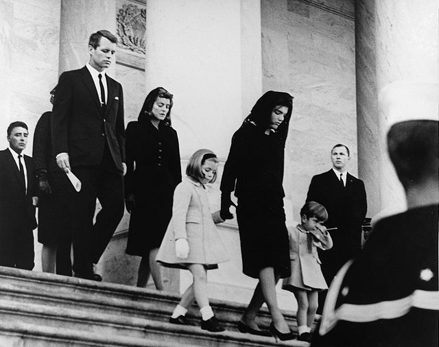 Mourners descend steps: Robert Kennedy, Jacqueline Kennedy holding children Caroline & John, after JFK's assassination.