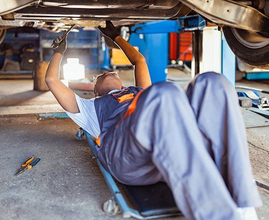Man Fixing Car — Lineville, AL — Donna’s Auto Parts