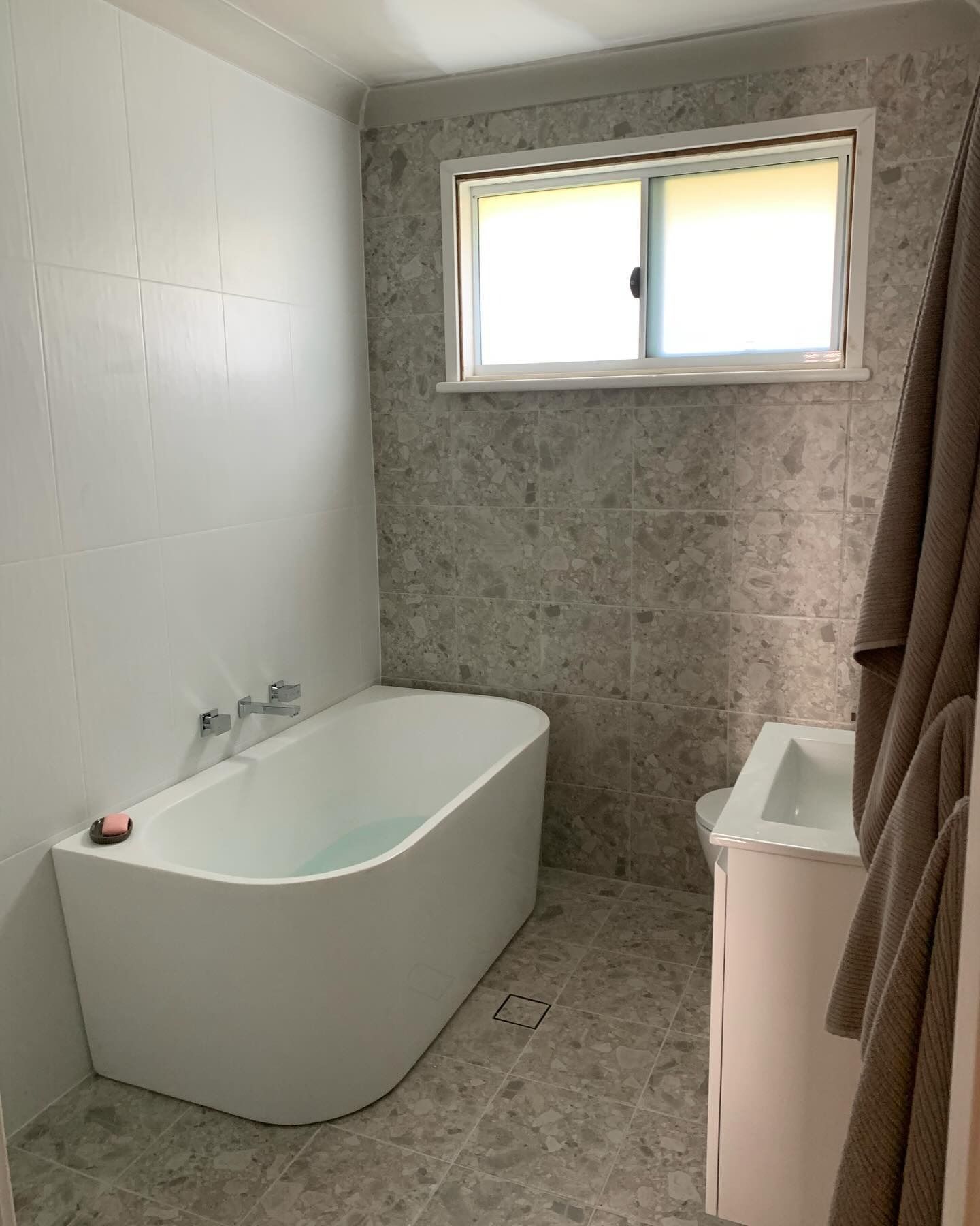 Bathroom with A White Freestanding Tub, Gray Tiled Walls — Cobra Plumbing & Bathrooms in Heathcote, NSW