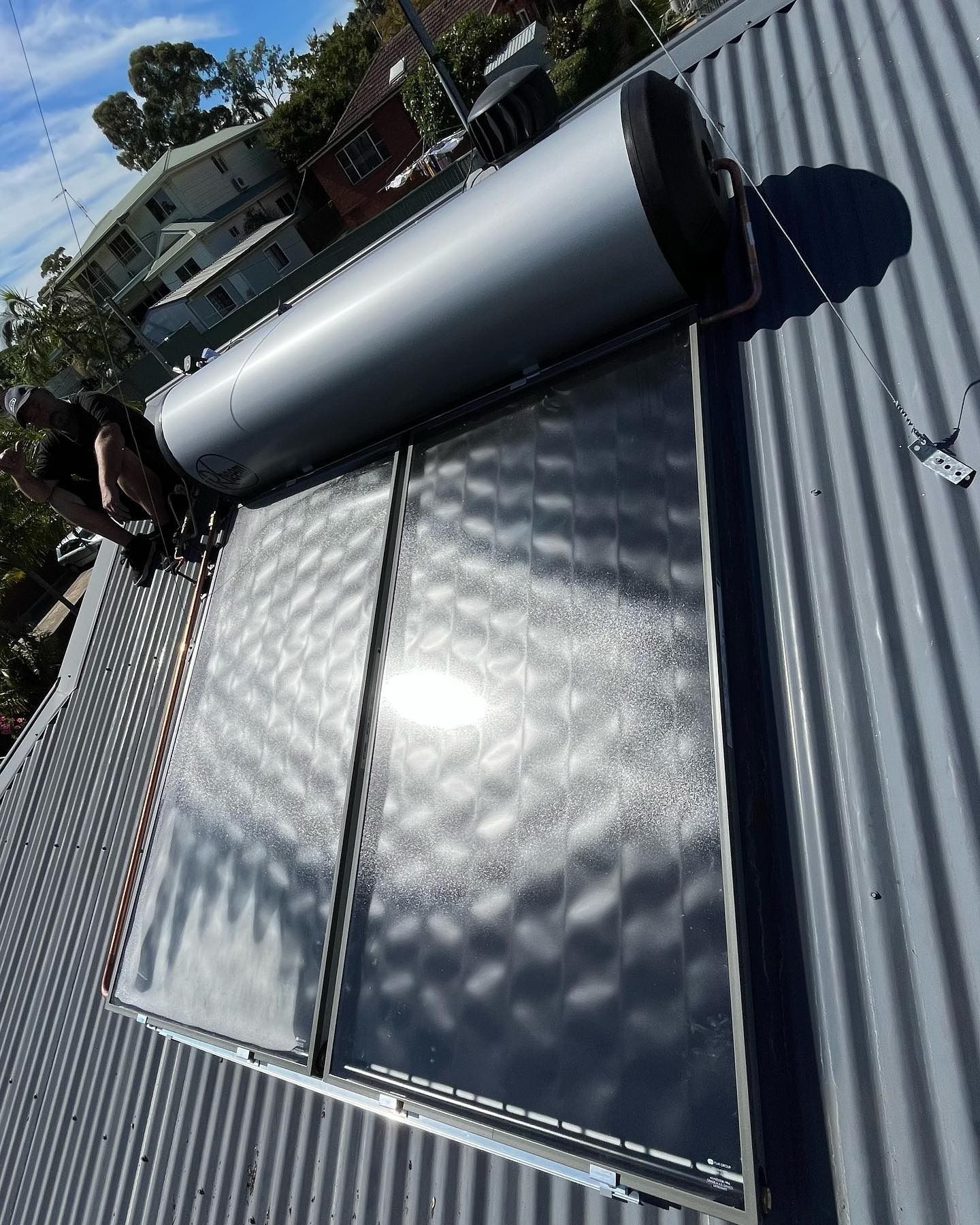 Solar Water Heater on a Corrugated Metal Roof — Cobra Plumbing & Bathrooms in Heathcote, NSW