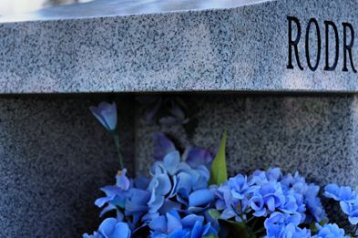 A close-up of a granite tombstone with 