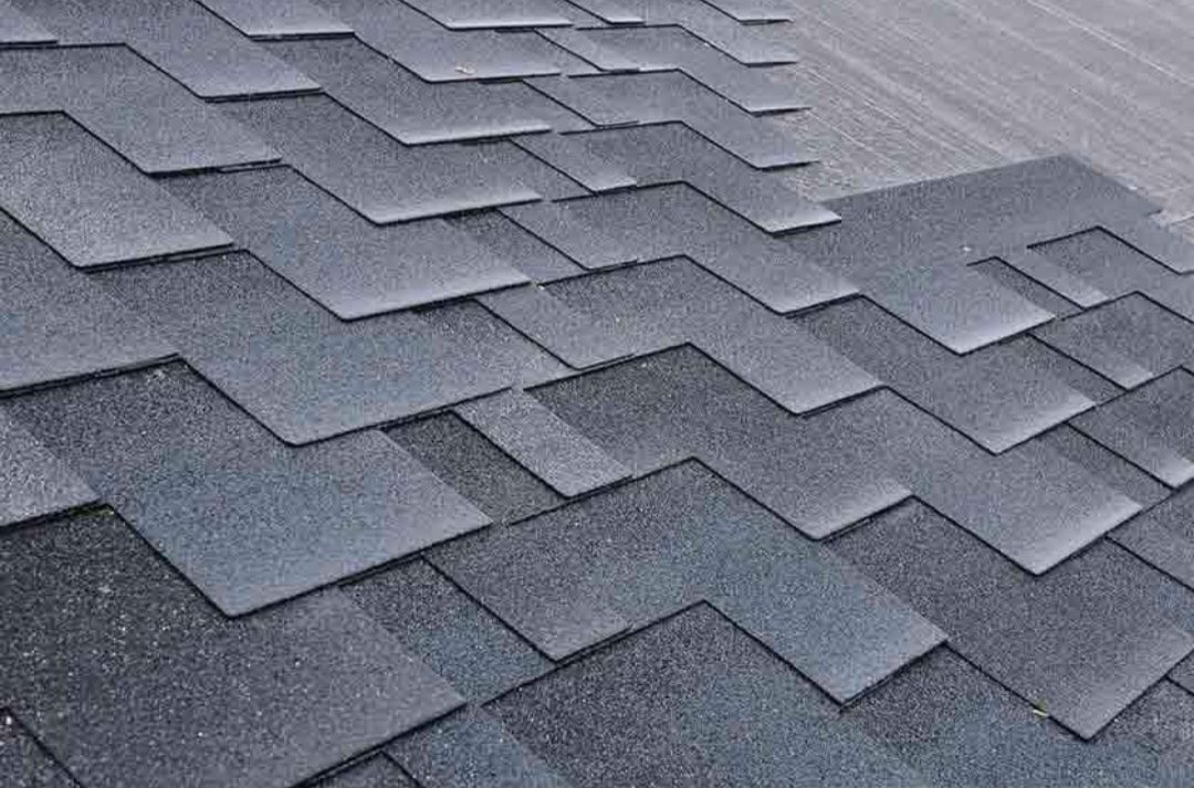 A close up of a roof with shingles on it.
