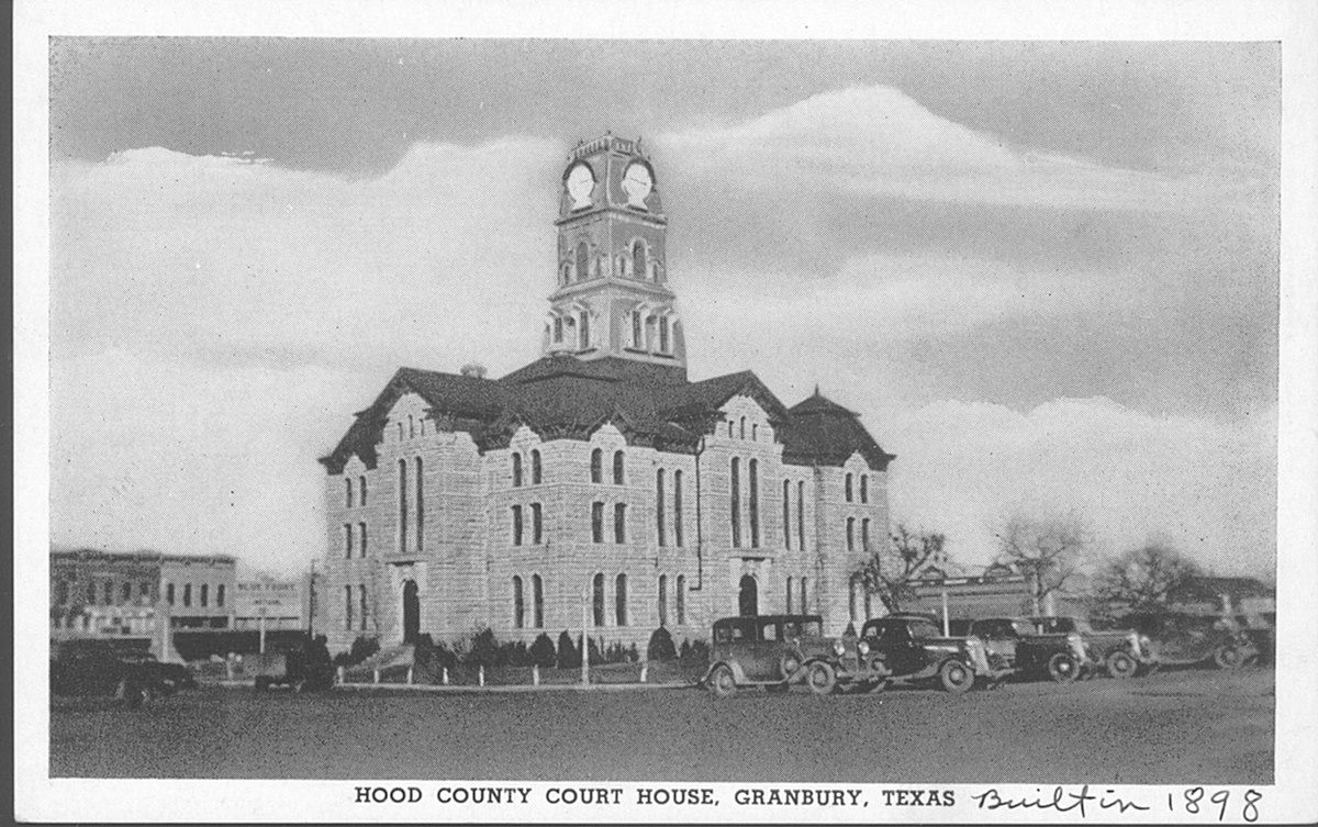 A black and white photo of a county court house