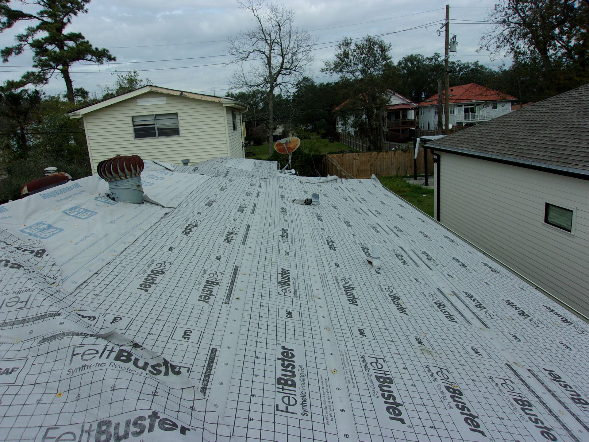 The roof of a house is covered with foil buster