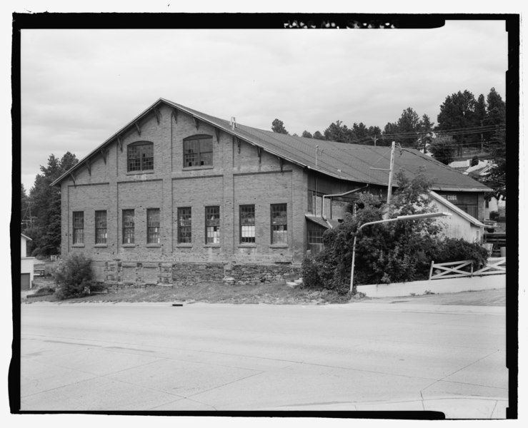 A black and white photo of a large brick building