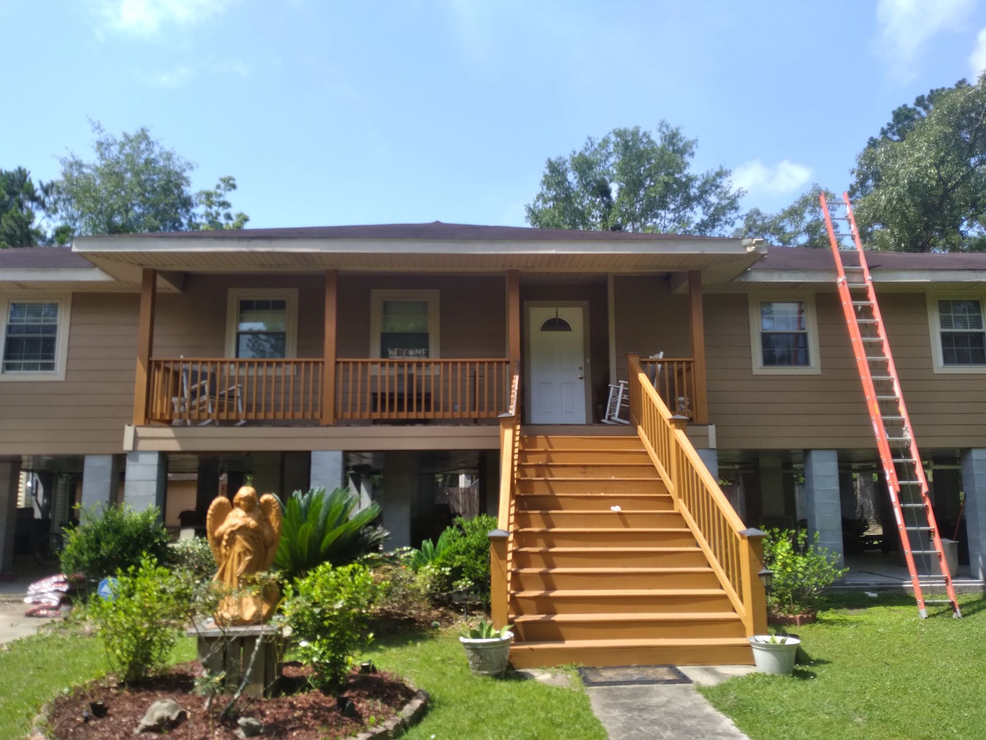 A house with a wooden porch and stairs