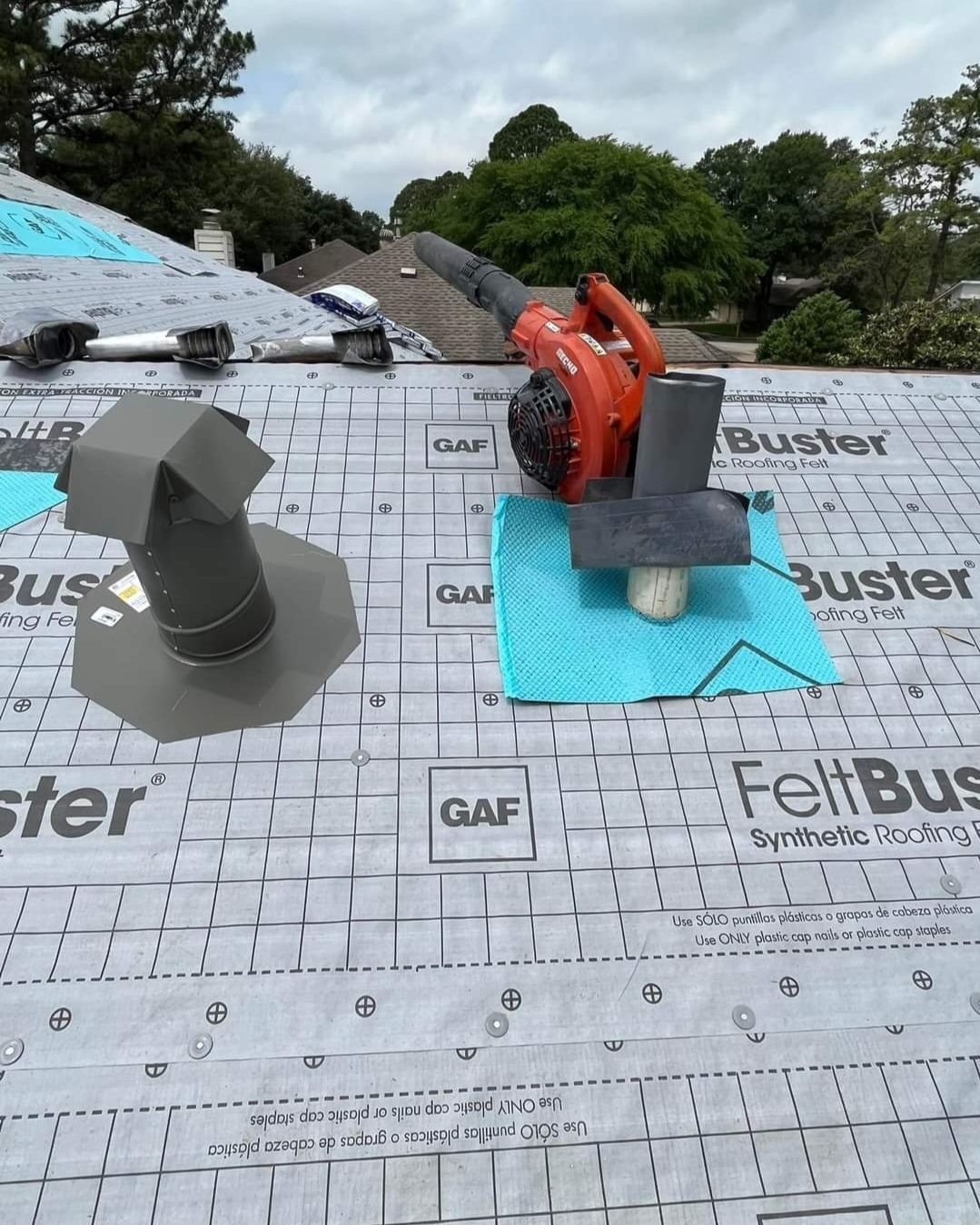 A roof with a blower on top of it