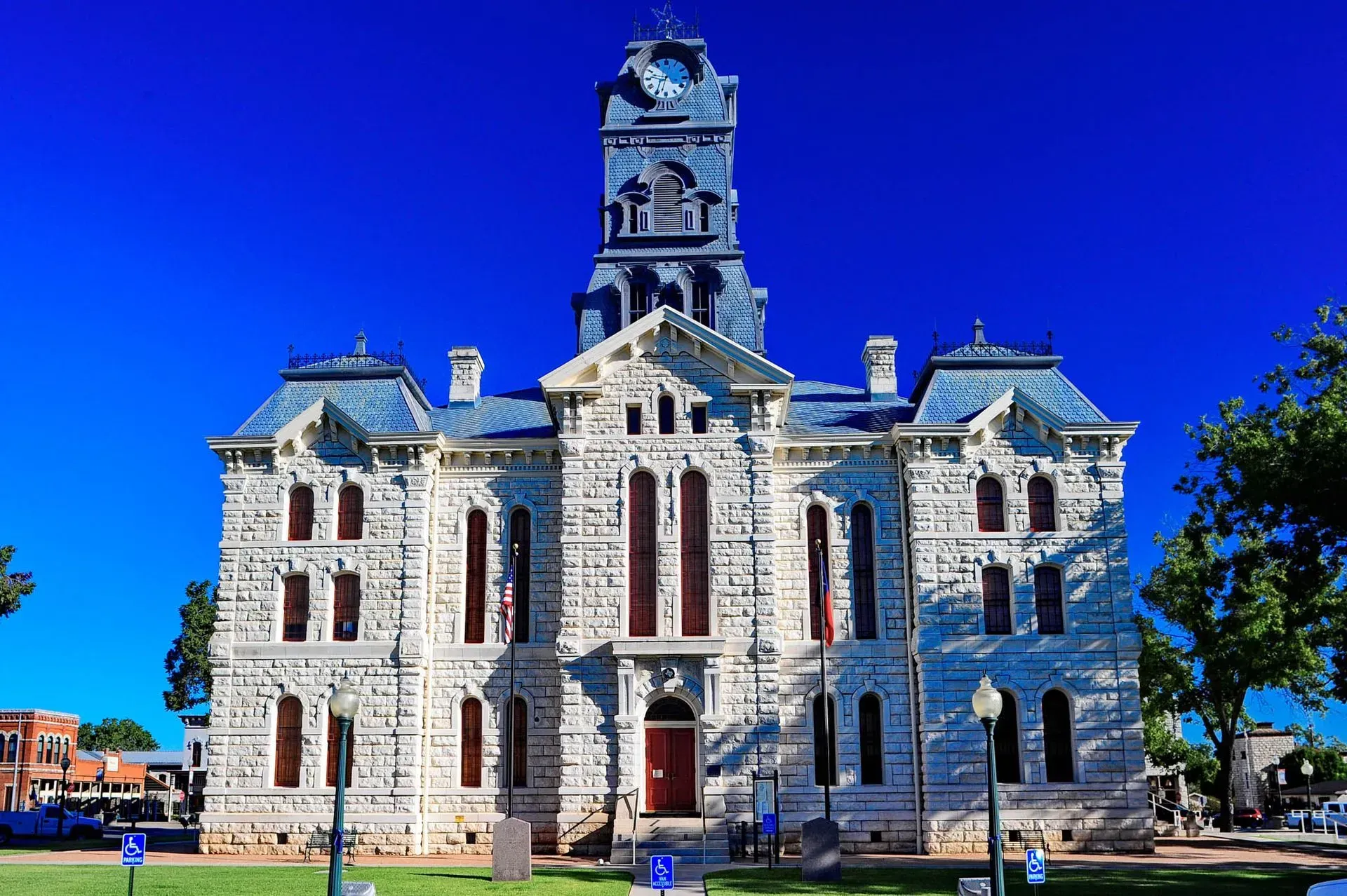 A large stone building with a clock tower on top of it