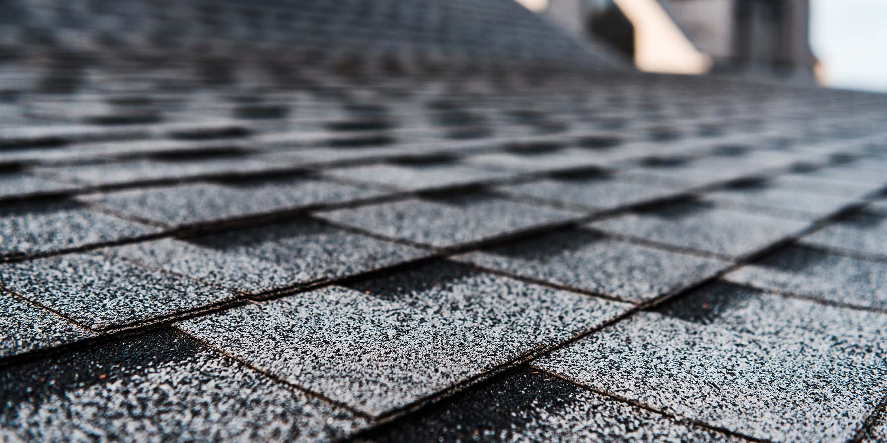 A close up of a roof with shingles on it.