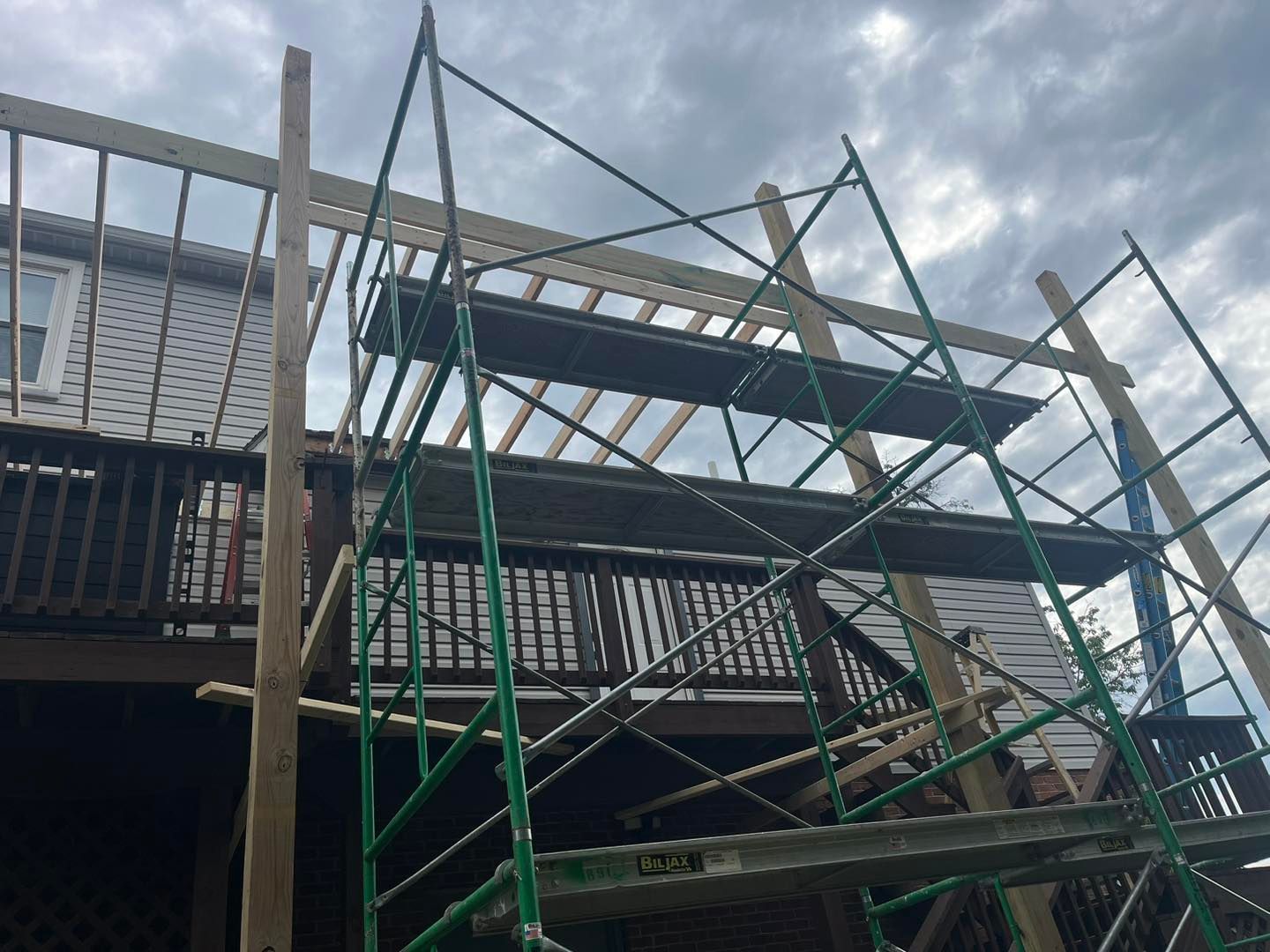 A house is being built with scaffolding around it.