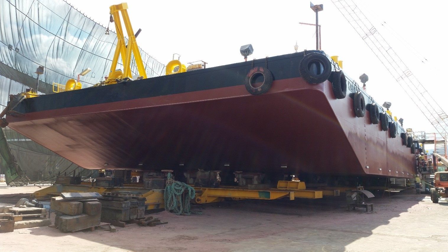 Large Red And Black Marine Vessel On Yellow Frame — On-Track Marine In Yorkeys Knob, QLD