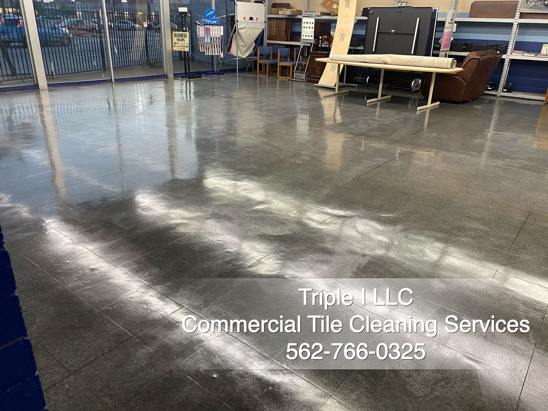 Triple I LLC | a shiny concrete floor in a room with tables and chairs.