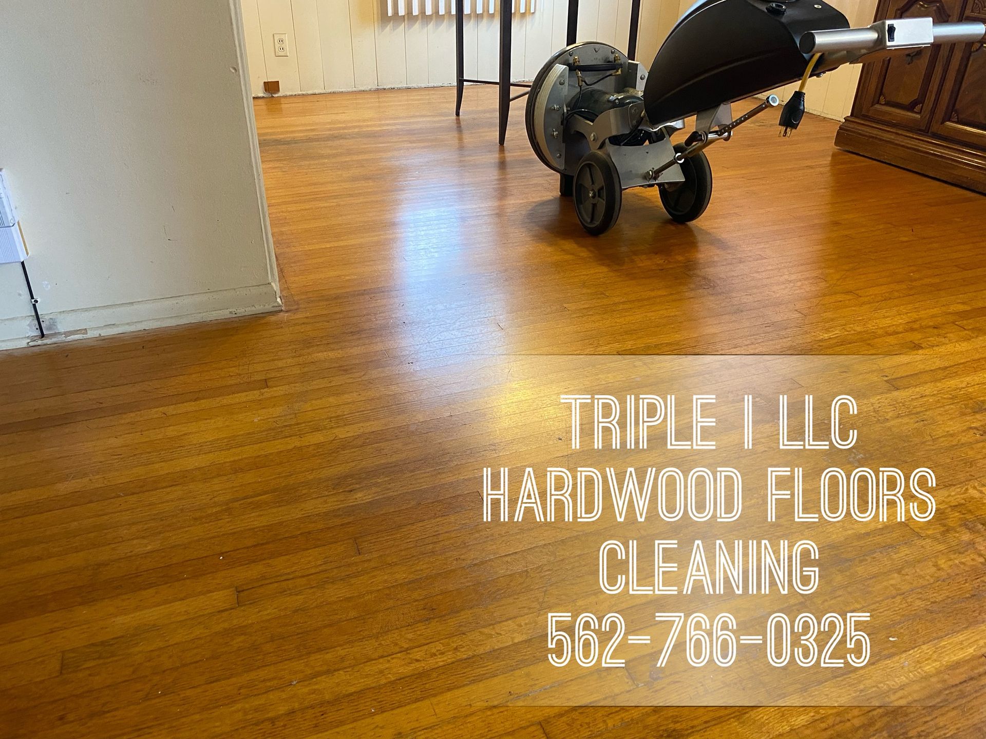 Triple I LLC | a vacuum cleaner is sitting on a hardwood floor.