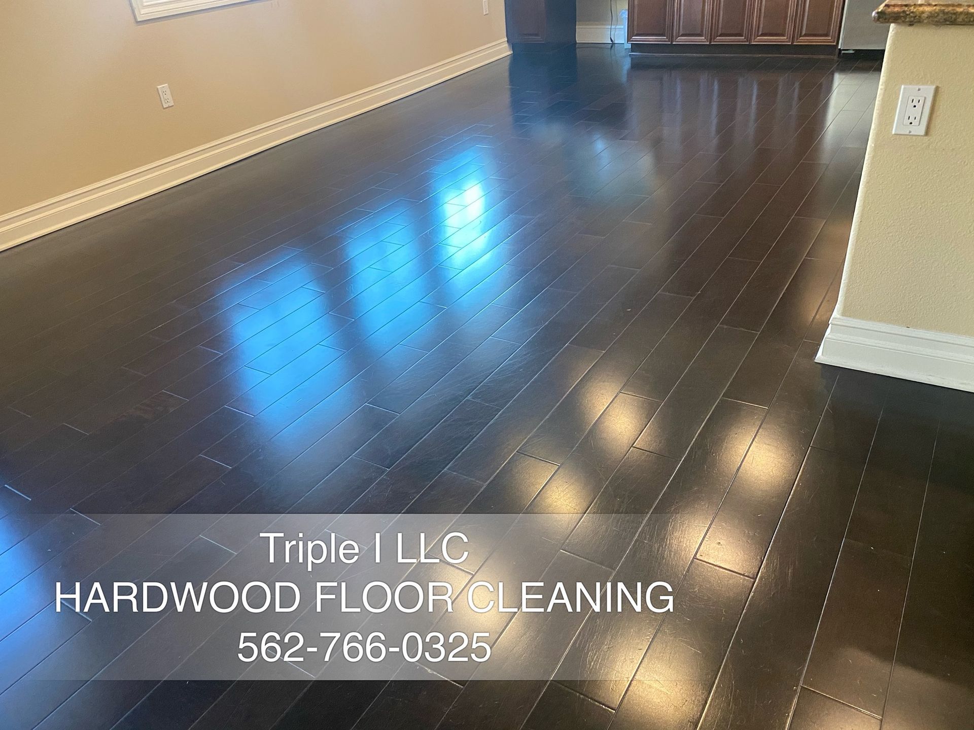 Triple I LLC | a hardwood floor is being cleaned by triple i llc hardwood floor cleaning