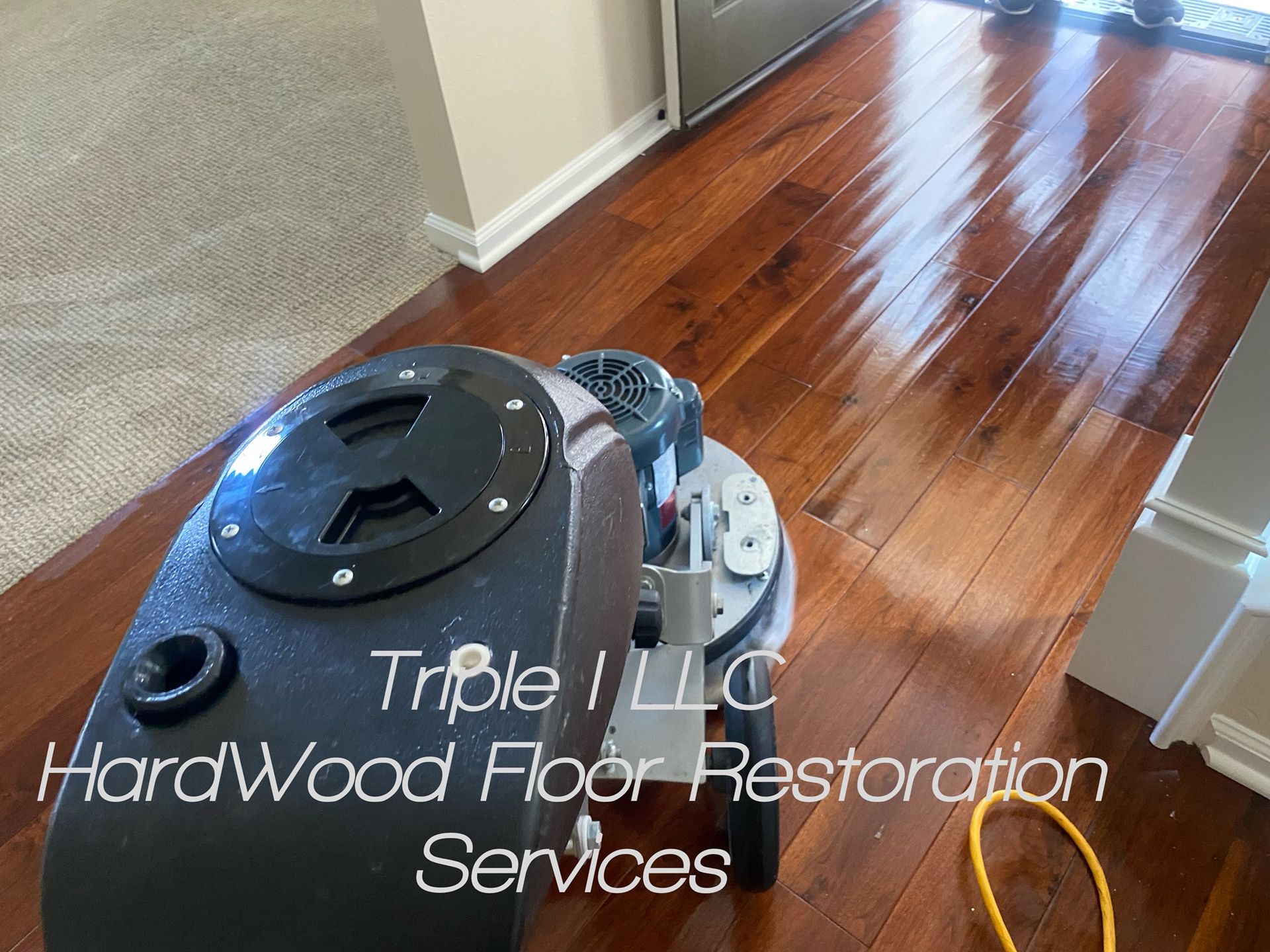 Triple I LLC | a vacuum cleaner is sitting on a hardwood floor.