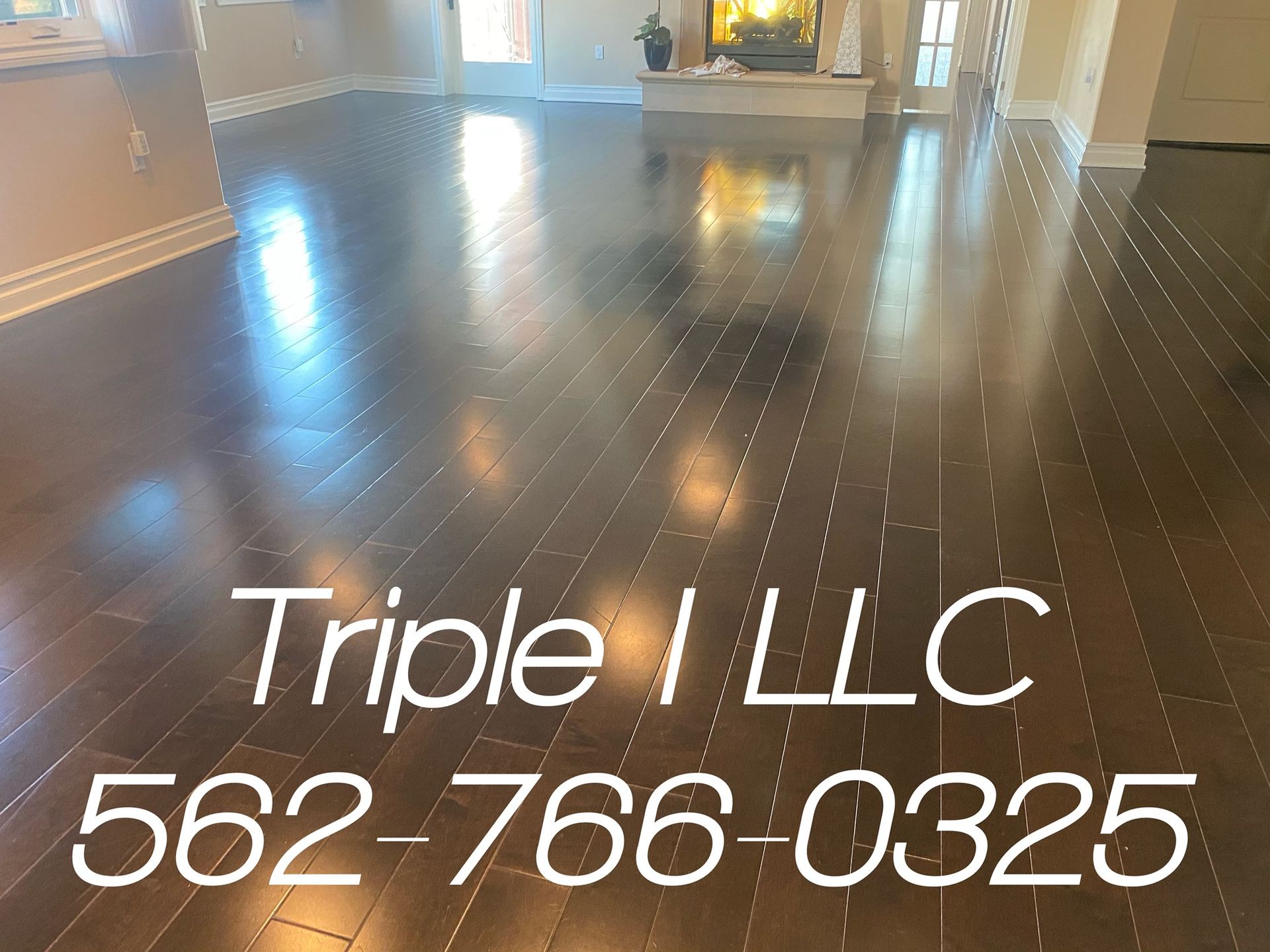 Triple I LLC | a living room with a hardwood floor and a phone number for triple i llc 562-766-0325