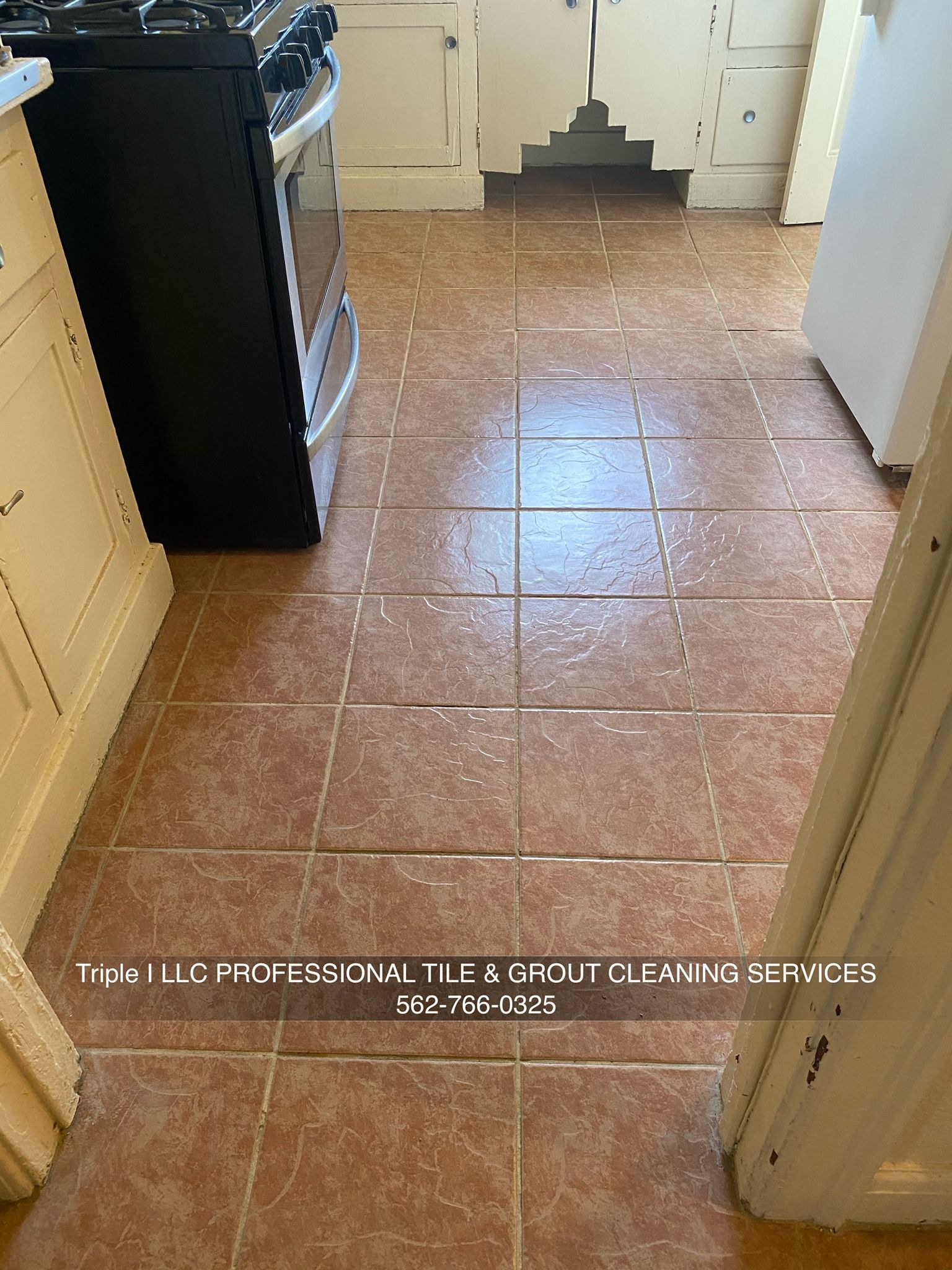 Triple I LLC | a kitchen with a tiled floor and a stove.