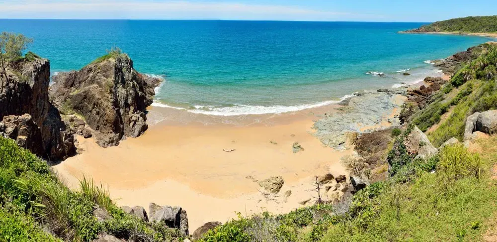 A View Of A Beach From A Cliff Overlooking The Ocean — Coastal Blind Installations In Agnes Waters, QLD