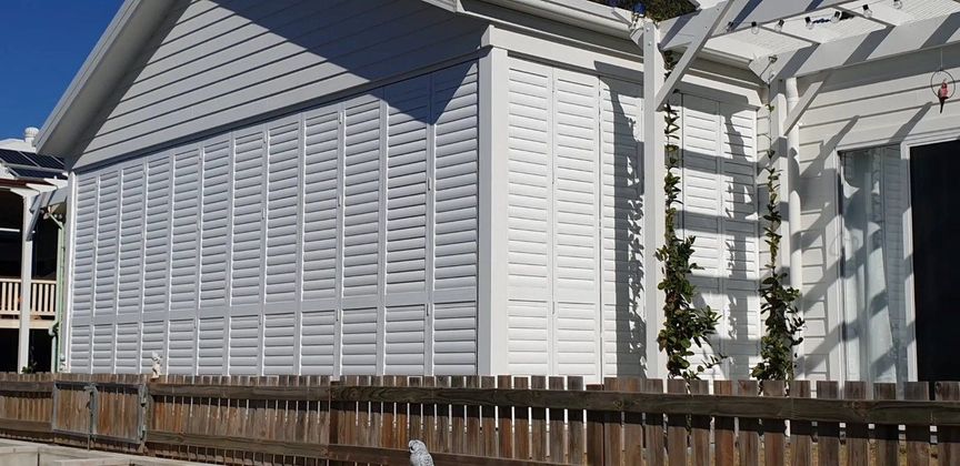 White Shutters With Plants — Shutters in Bundaberg, QLD