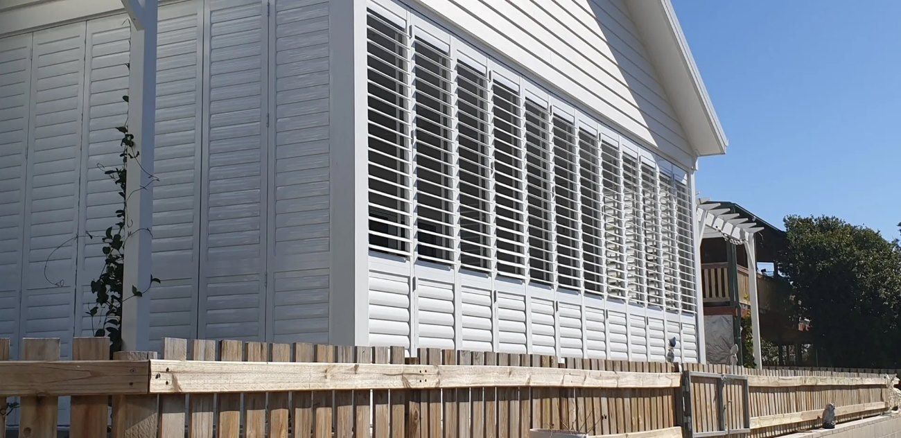 Many White Shutters Outdoors — Shutters in Bundaberg, QLD