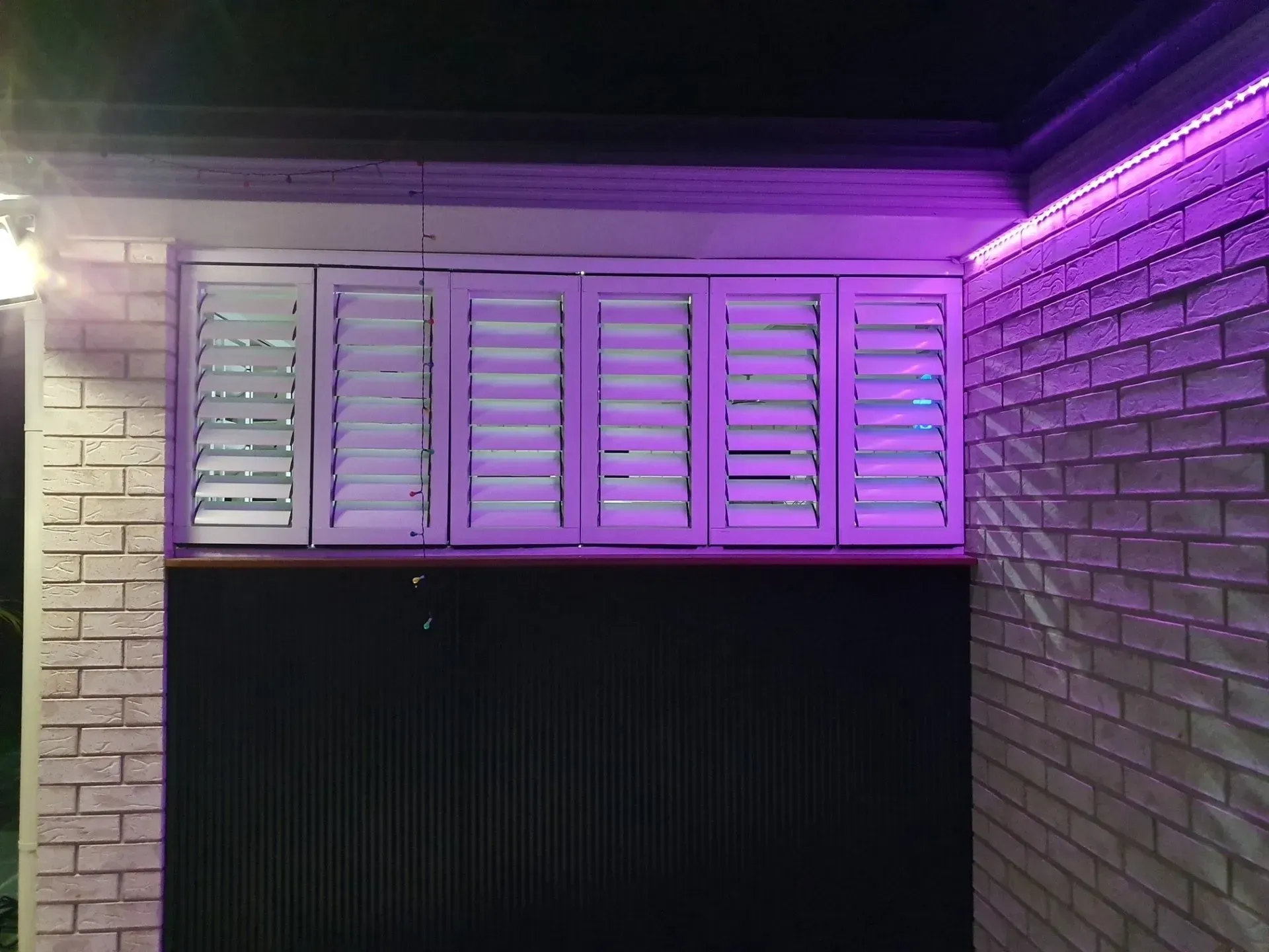 Outdoor Blinds In Blue Light — Shutters in Bundaberg, QLD