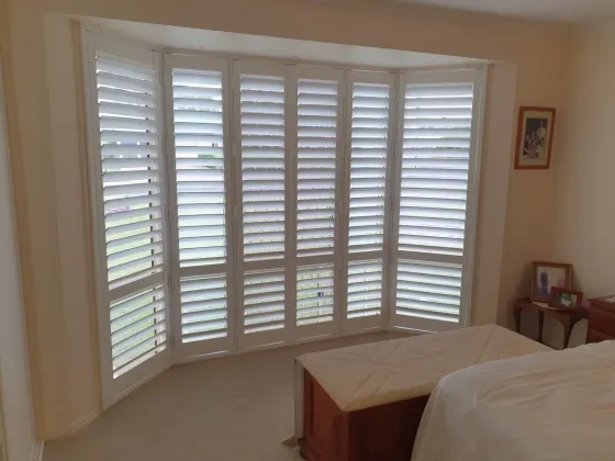 Bi-Fold Shutters In Bedroom — Shutters in Bundaberg, QLD