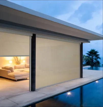 Dropdown Awnings Around The Pool At Night — Shutters in Bundaberg, QLD