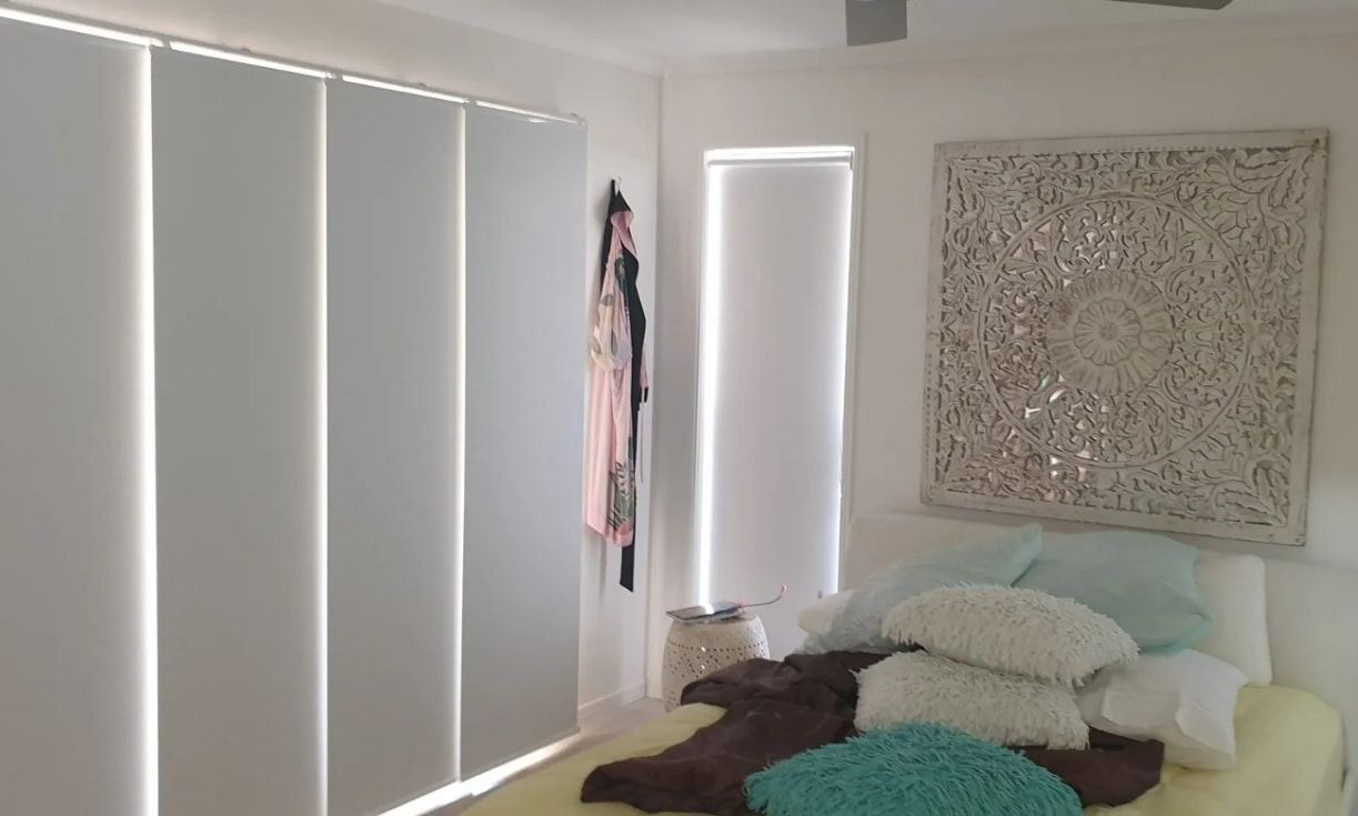 A Bedroom With A Bed And A Painting On The Wall — Coastal Blind Installations In Kensington, QLD