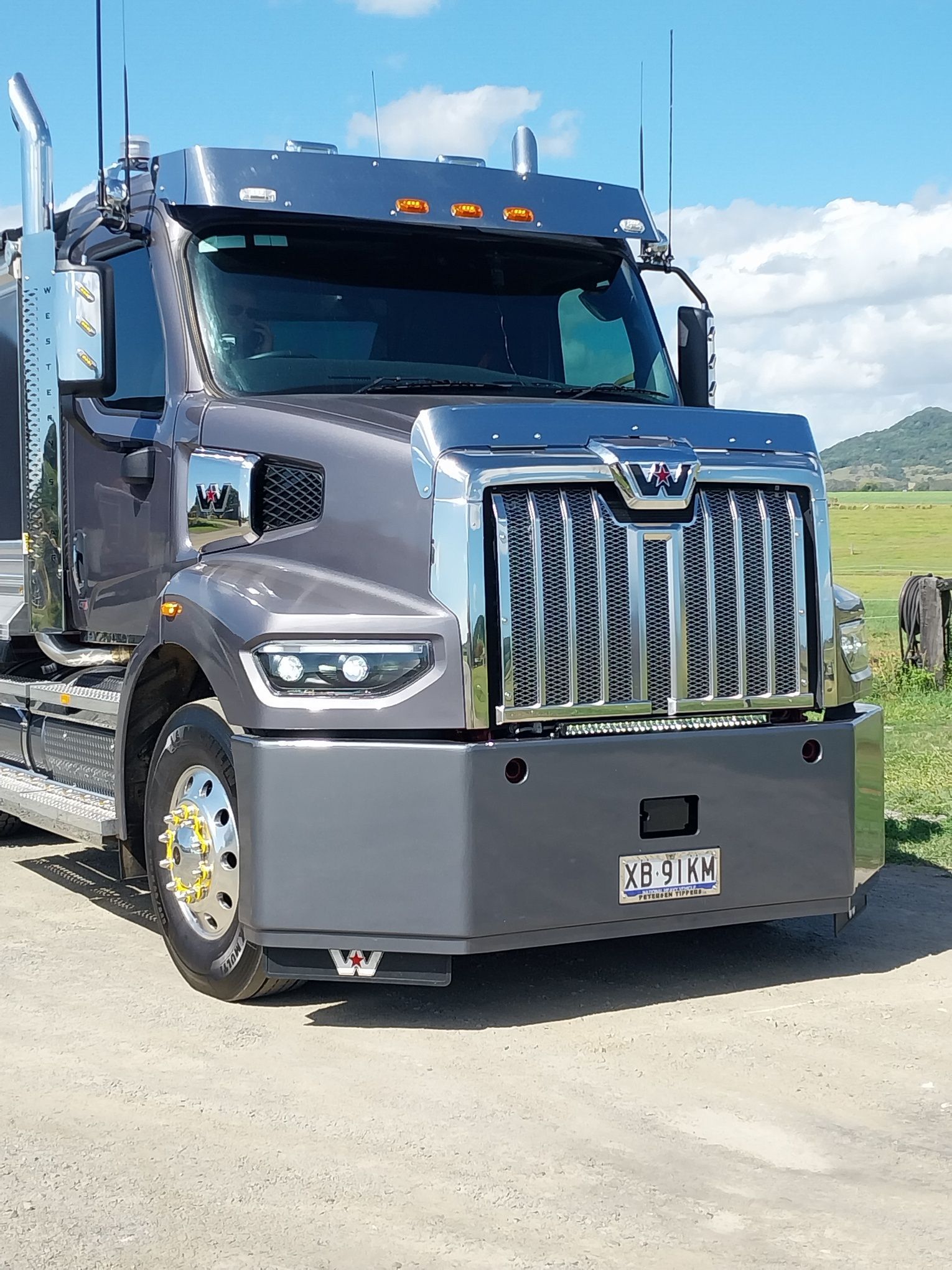 A Large Semi Truck Is Parked In A Dirt Lot In A Field — Petersen Tippers in Farleigh, QLD