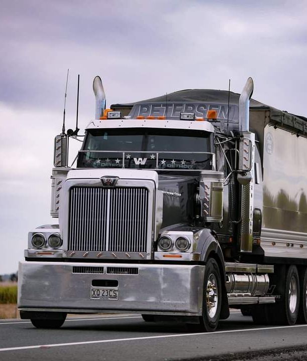 A Silver Semi Truck With A License Plate That Says WPC — Petersen Tippers in Farleigh, QLD