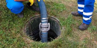 Professional septic tank repair service fixing damaged underground tank system