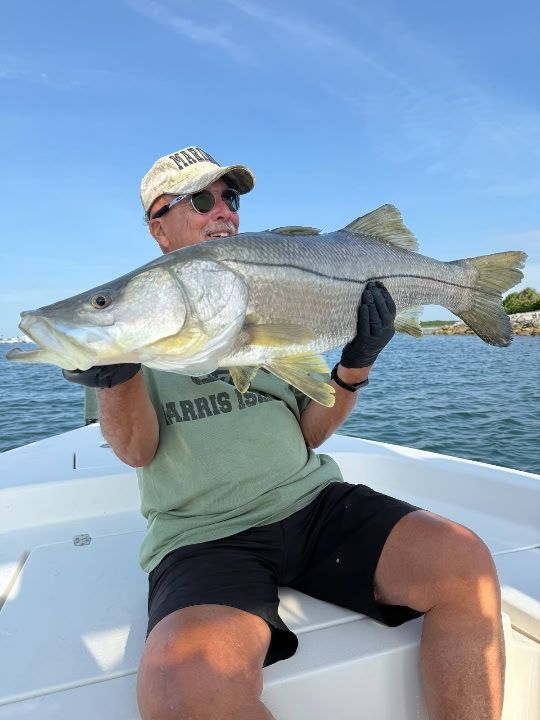 Ron with a snook he landed off the coast of Cape Canaveral, Florida, during a 2025 fishing trip.
