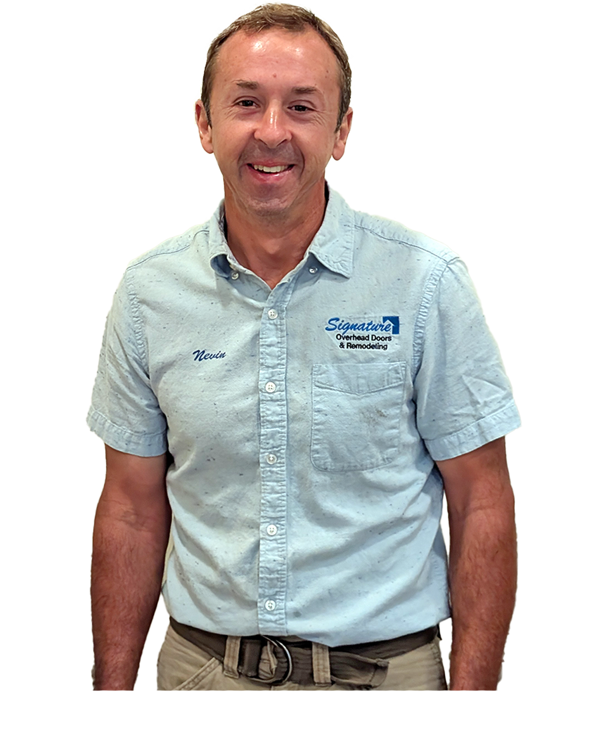 Man in light blue shirt, smiling, wearing a belt, in front of a white background.