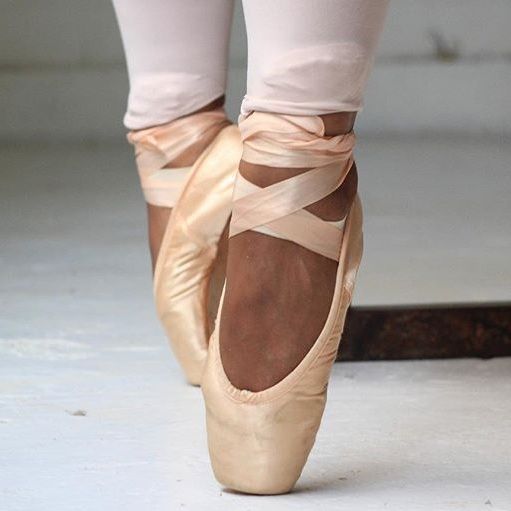 Ballet dancer's feet in pink pointe shoes