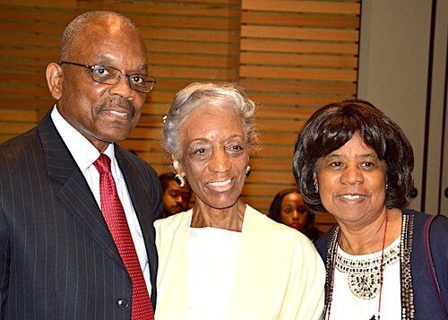 Three people posing for a photo