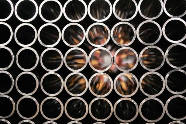 Close-up view of Galvanised Pipe in black and white, steel piping in industrial background.