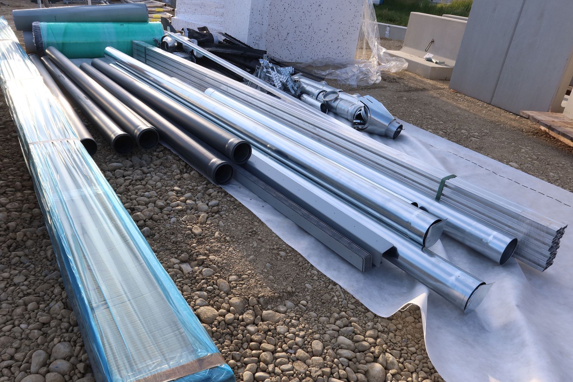 Galvanised pipes at a construction site.