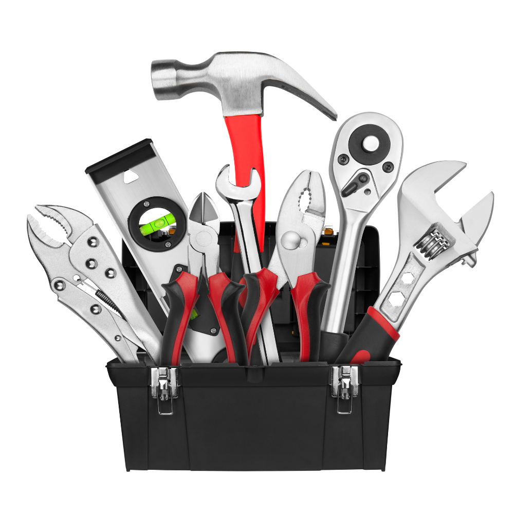 Assorted hand tools in a black toolbox, including hammer, wrench, pliers, tape measure, and saw.