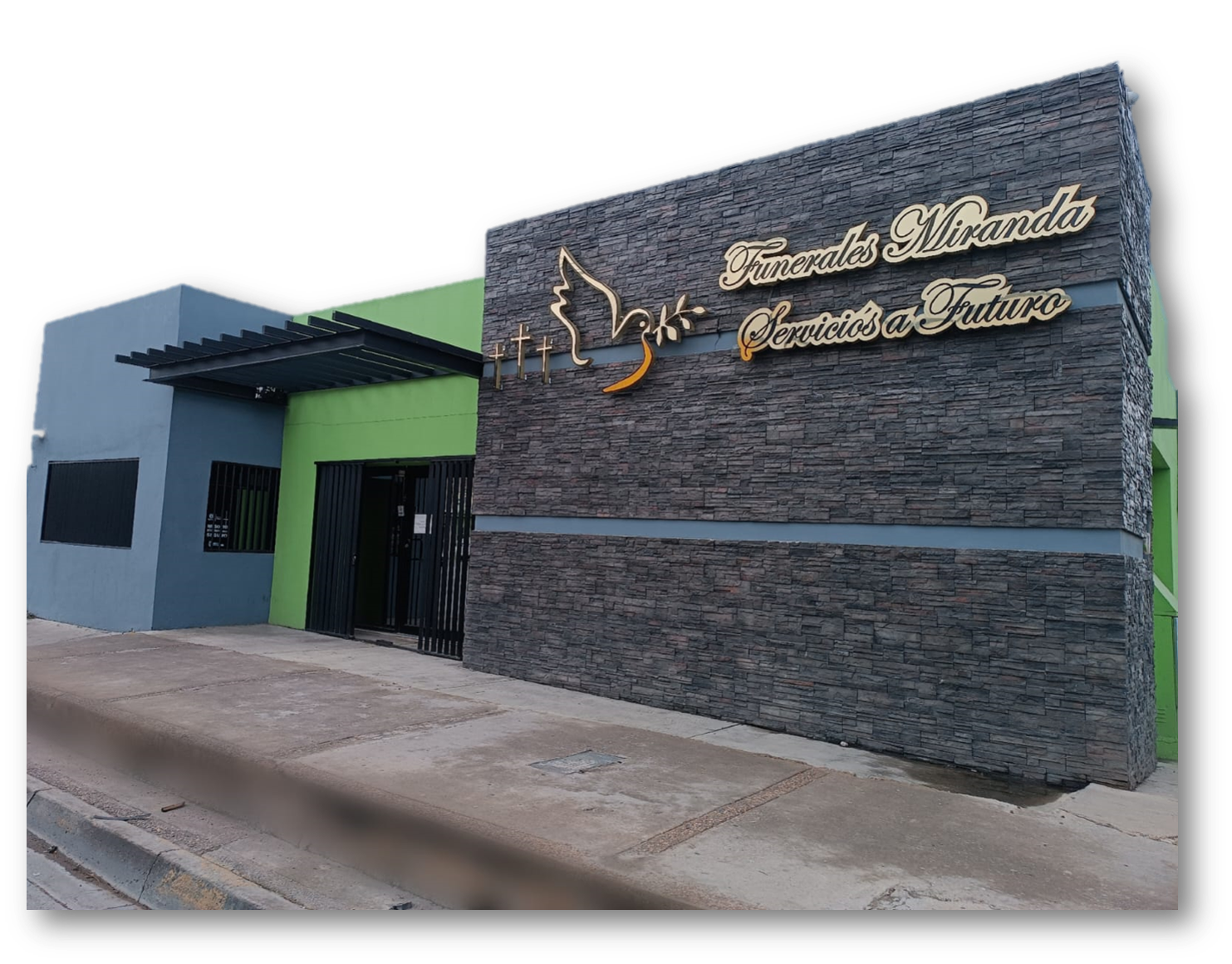 Un edificio con un cartel al costado que dice 'escuela'