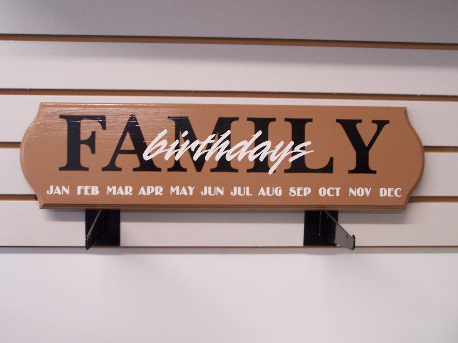 A sign on a wall that says family birthdays