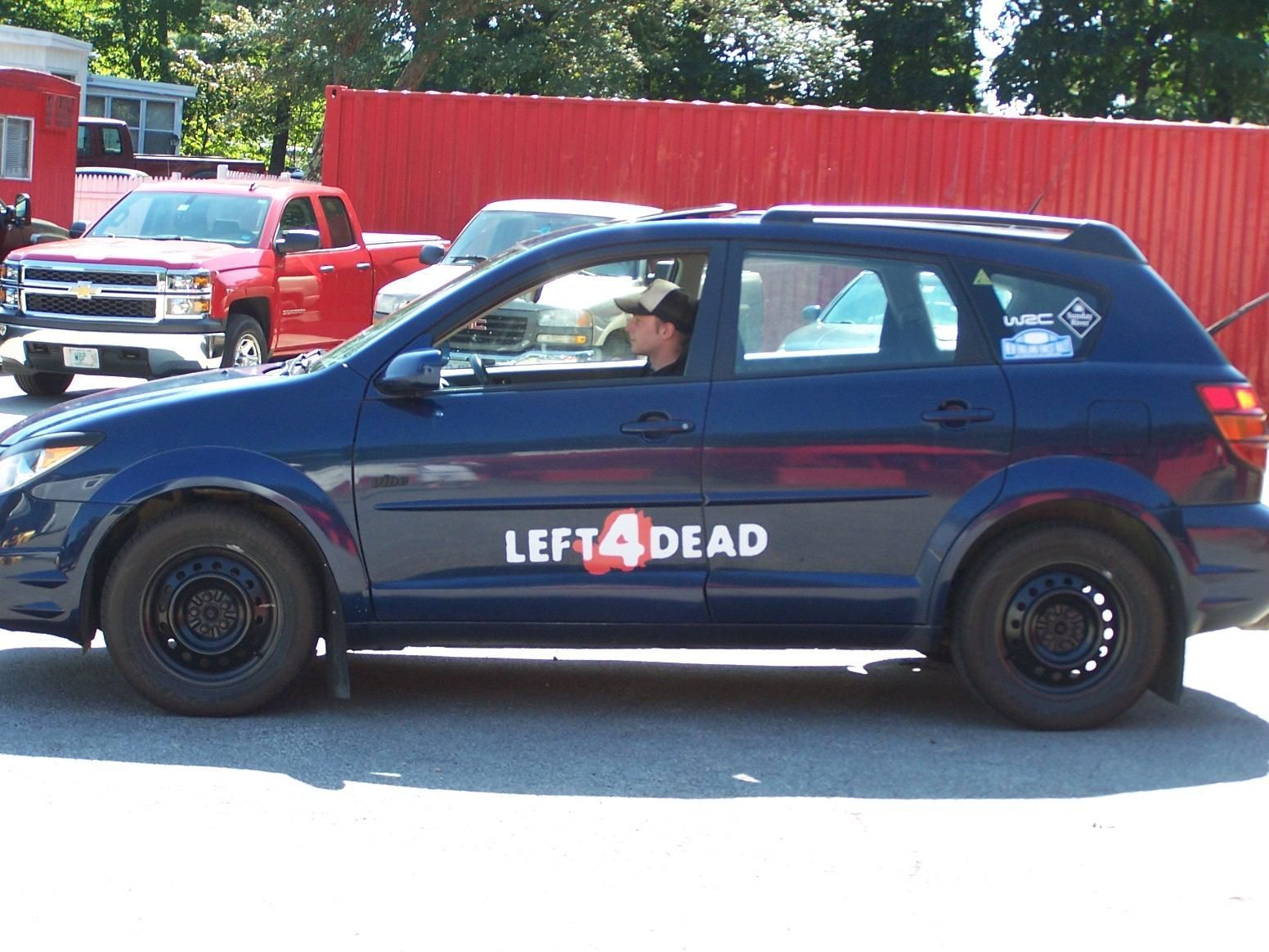 A blue car with the word left4dead on the side