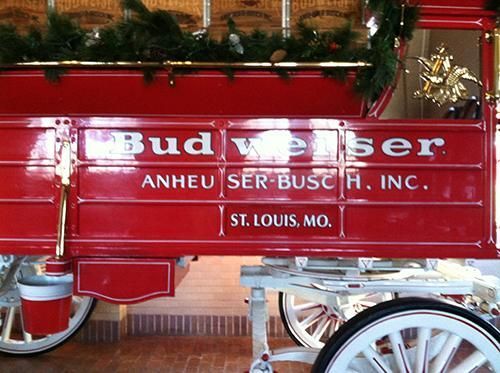 A red wagon with budweiser written on it