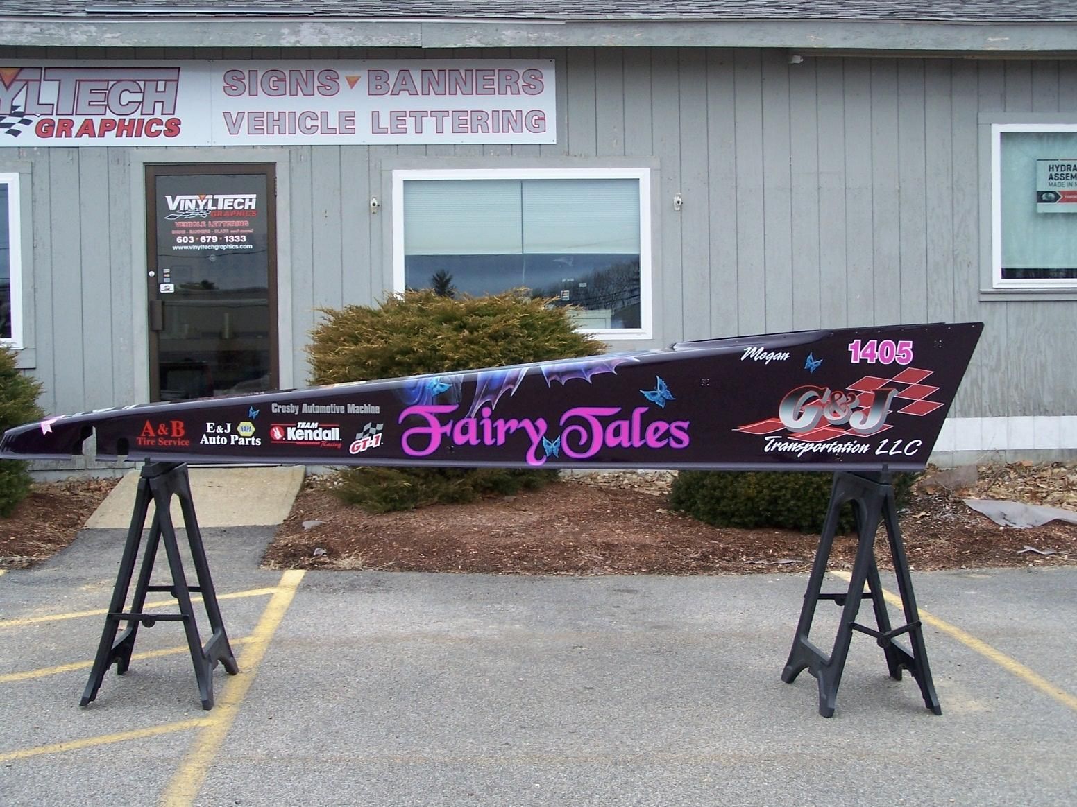 A sign for fairy tales sits in front of a building