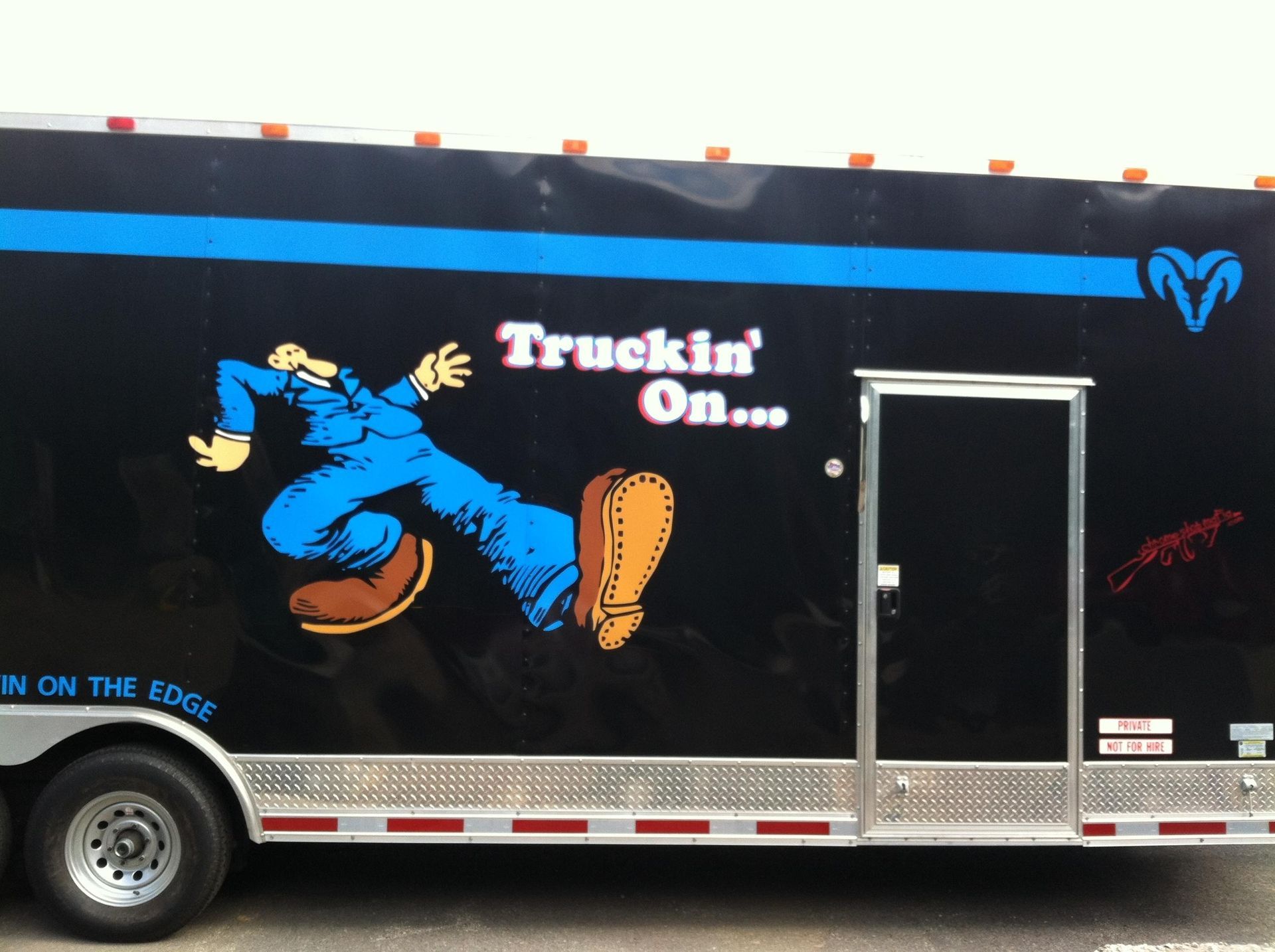 A truck that says truckin ' on on the side