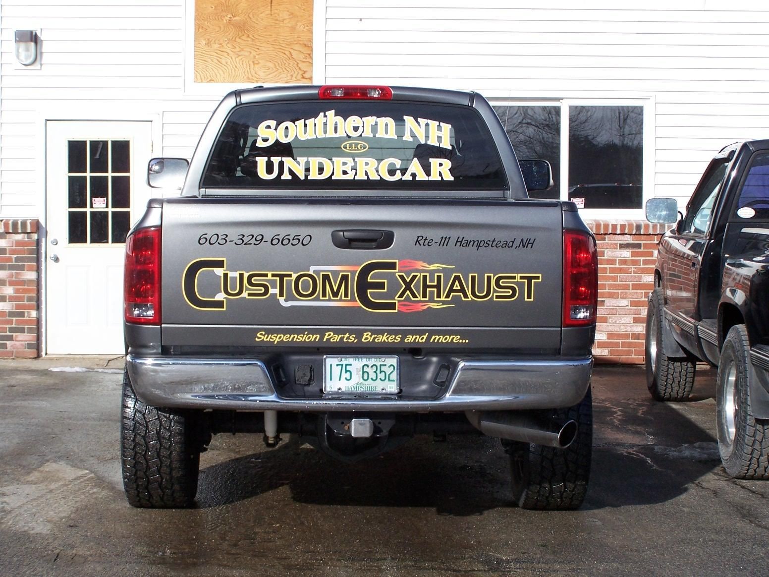 A truck with southern nh undercar custom exhaust written on the back