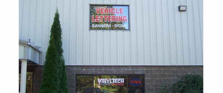 A white truck with the word upright on the back