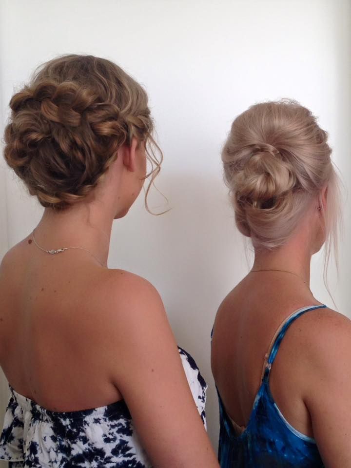 Two Women Are Standing Next to Each Other With Their Hair in Buns — Coolum Cutting Edge in Peregian Springs, QLD