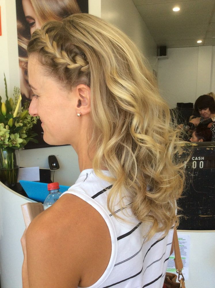 A Woman With Blonde Hair is Wearing a Braided Headband — Coolum Cutting Edge in Coolum, QLD